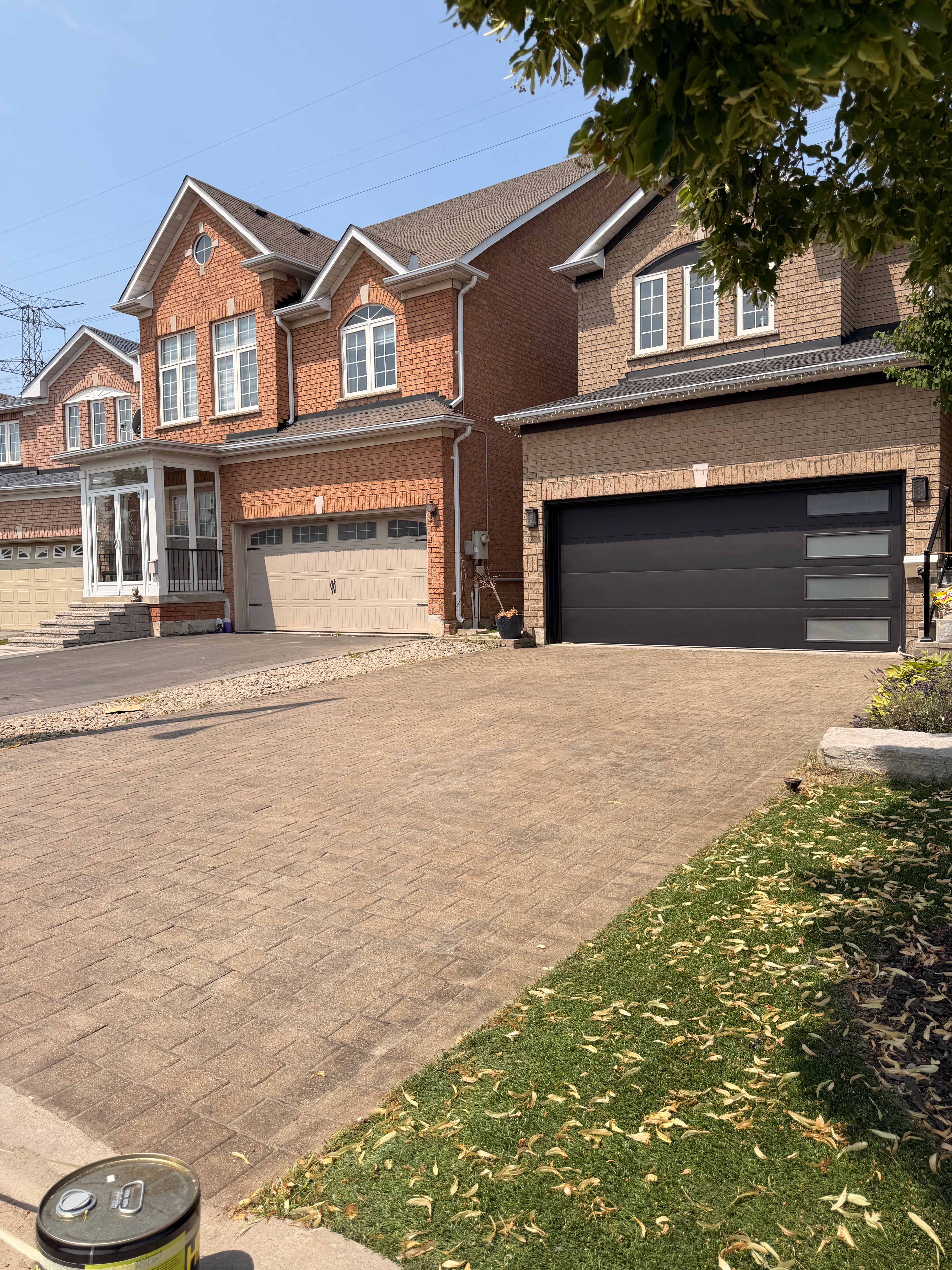 After: front driveway interlock cleaned — all weeds removed and joints restored