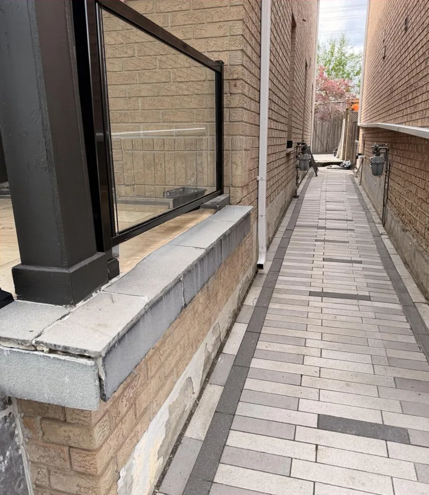 After: side interlock walkway fully cleared — clean joints, no weeds